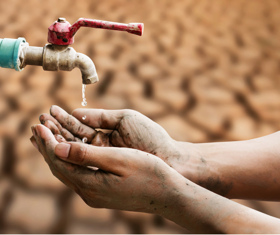 Close-up of hands under a dripping faucet with a cracked, dry earth background, symbolizing water scarcity exacerbated by El Niño.